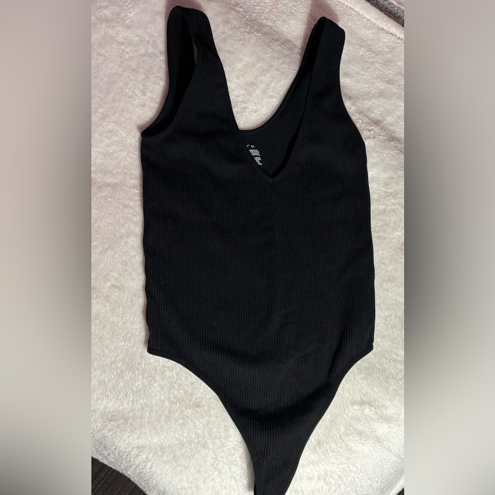 Black ribbed body suite.